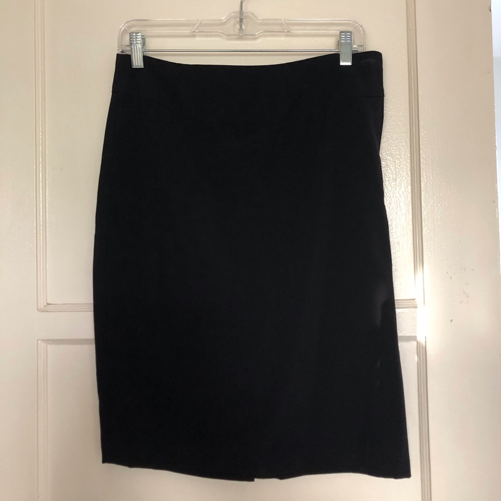 Cute knee length black skirt.